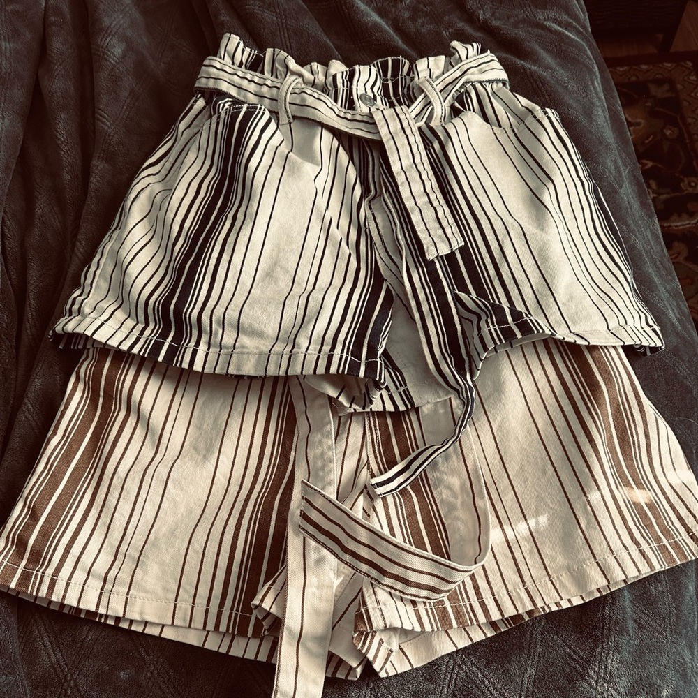 2 pair of shorts in good condition. Size Small. Blue/White and Brown/White